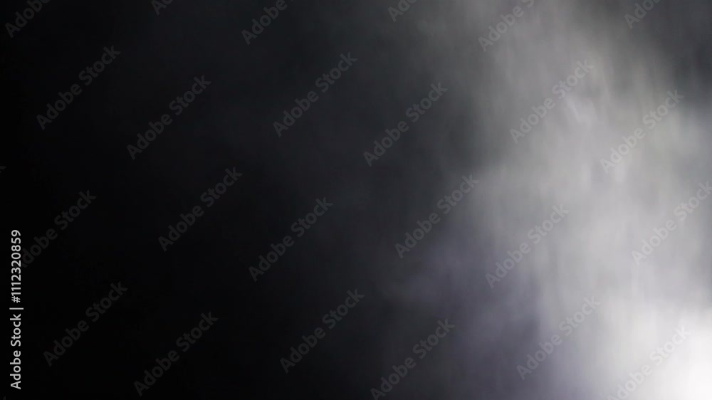 Abstract white smoke in slow motion. Smoke, Cloud of cold fog in light spot background. Light, white, fog, cloud, black background, 4k, ice smoke cloud. Floating fog. Abstract white smoke in slow motion. Smoke, Cloud of cold fog in light spot background. Light, white, fog, cloud, black background, 4k, ice smoke cloud. Floating fog.