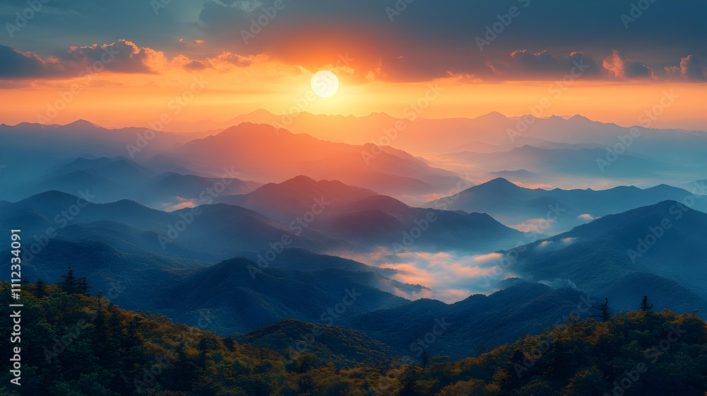Fototapeta premium A breathtaking view of a sunrise casting warm hues over misty mountain layers in a tranquil atmosphere