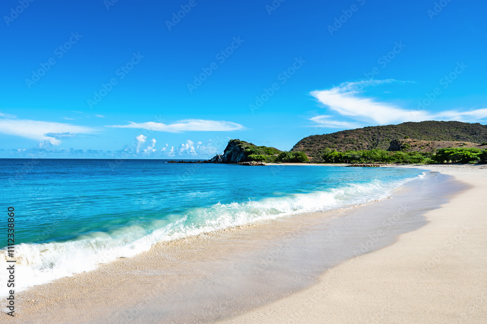beautiful beach with a blue ocean and a mountain in the background beautiful beach with a blue ocean and a mountain in the background