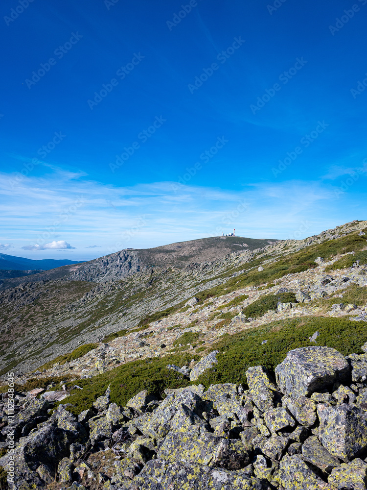 Panoramic view of the Sierra de Guadarrama with clear skies. On the horizon, the iconic weather radar atop the summit is visible. Panoramic view of the Sierra de Guadarrama with clear skies. On the horizon, the iconic weather radar atop the summit is visible.