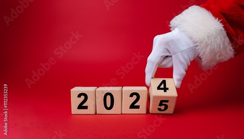 Wallpaper Mural Gloved hand in Santa suit changes wooden block from 2024 to 2025 on bright red background. Torontodigital.ca
