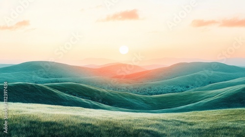 A panoramic view of rolling hills with a sunset over a distant mountain range.