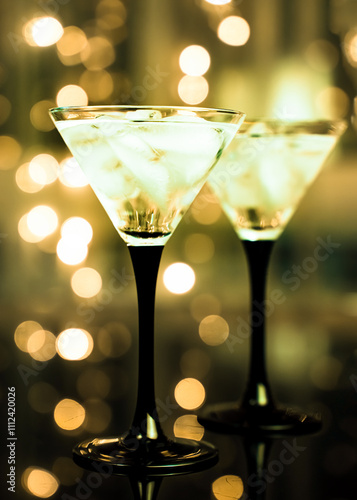 Wallpaper Mural Two glasses of fresh cocktail with ice on black bokeh background. Trending green. Torontodigital.ca