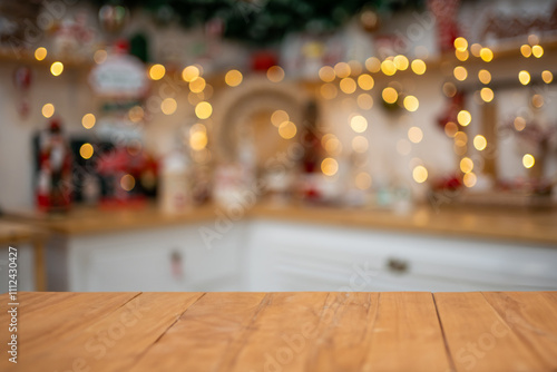 Empty wooden table on the background of christmas kitchen, golden bokeh.Christmas background. Merry Christmas and Happy New Year