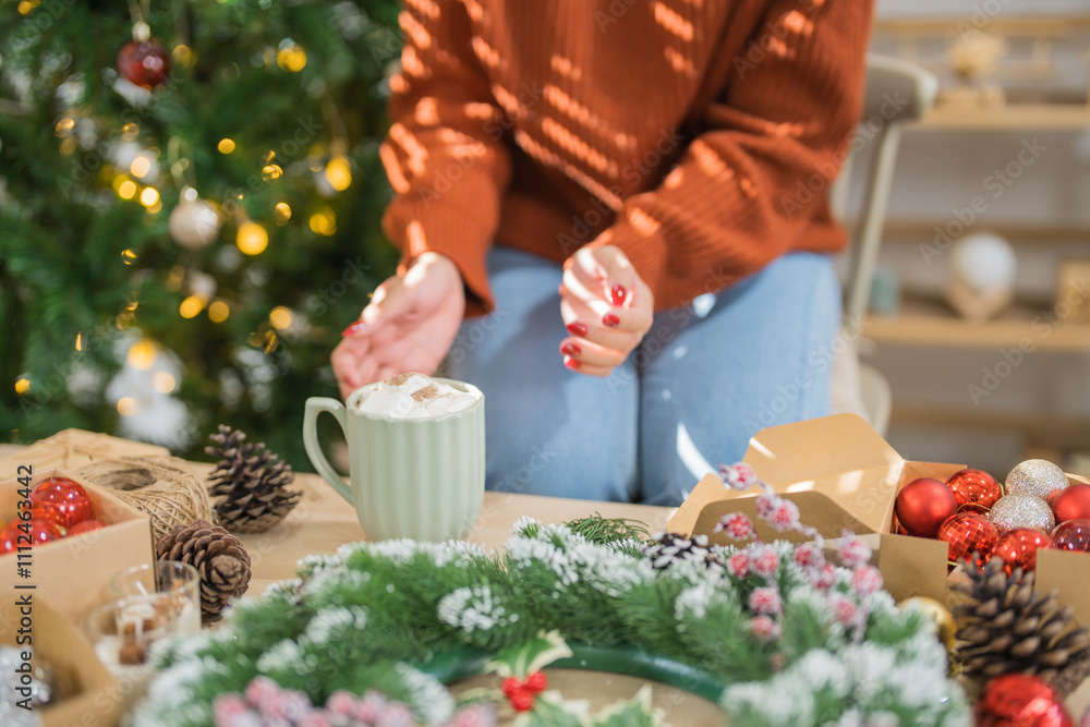 Woman holding cup of aromatic cocoa with marshmallows. Christmas eve with cup of tasty hot chocolate cozy holiday atmosphere at home Woman holding cup of aromatic cocoa with marshmallows. Christmas eve with cup of tasty hot chocolate cozy holiday atmosphere at home