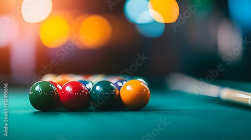 Close-up of colorful billiard balls on a green felt table