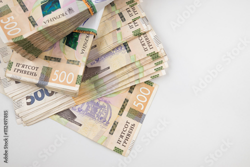 on a white background a pack of hryvnias. Financial concept. Ukrainian money. 500 hryvnias on a white background. photo