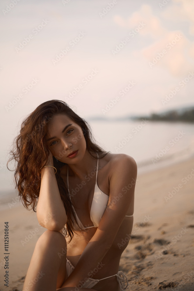 Beautiful model in sand on the beach. Sexy girl in Bikini Beautiful model in sand on the beach. Sexy girl in Bikini