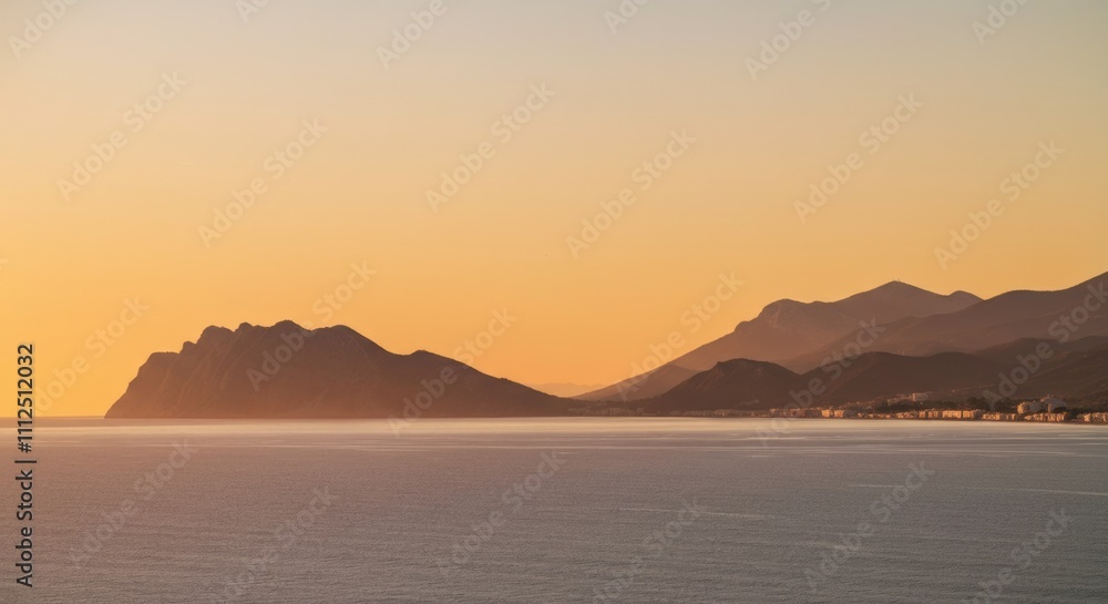 Sunset Over Coastal Mountains and Calm Sea Sunset Over Coastal Mountains and Calm Sea