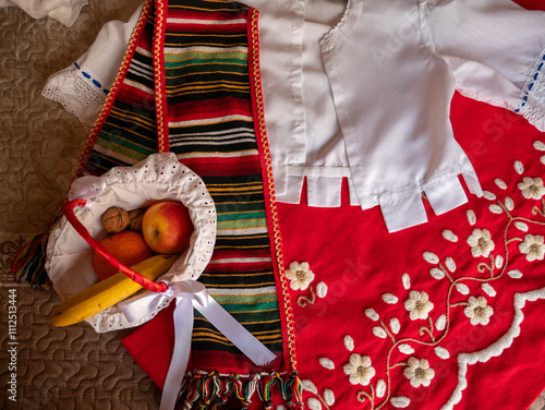 Traje tradicional del sur de España en color rojo y bordado a mano photo