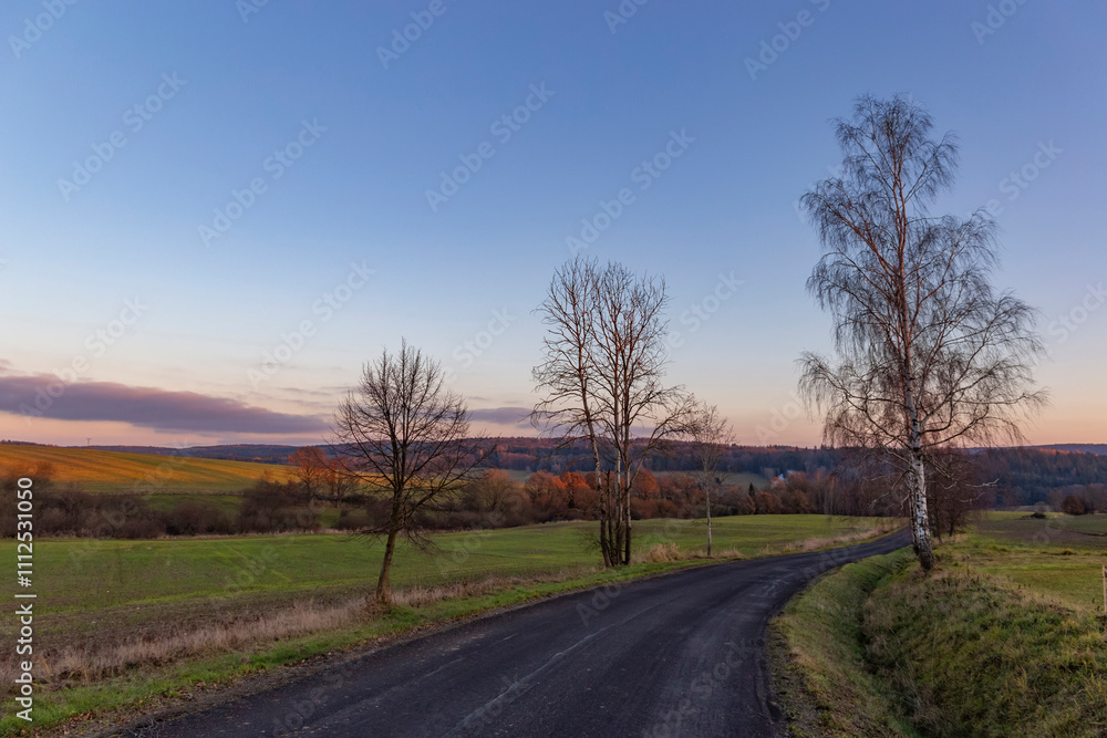 A country road at sunset. The last day of autumn.