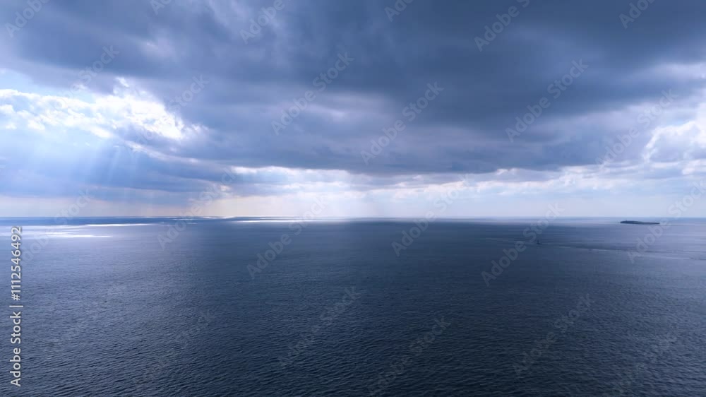 The mysteriousness of the sun shining through clouds from the sky, the sea, and Songaksan Dulle-gil, Jeju Island, Korea The mysteriousness of the sun shining through clouds from the sky, the sea, and Songaksan Dulle-gil, Jeju Island, Korea