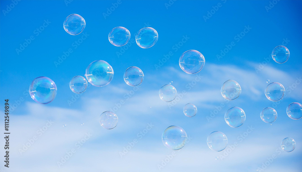Soap bubbles floating in blue sky. Abstract backdrop. Soap bubbles floating in blue sky. Abstract backdrop.