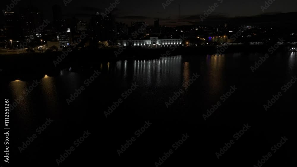 Drone flies low over Bahia de Asuncion toward Puerto de Asuncion at night Drone flies low over Bahia de Asuncion toward Puerto de Asuncion at night