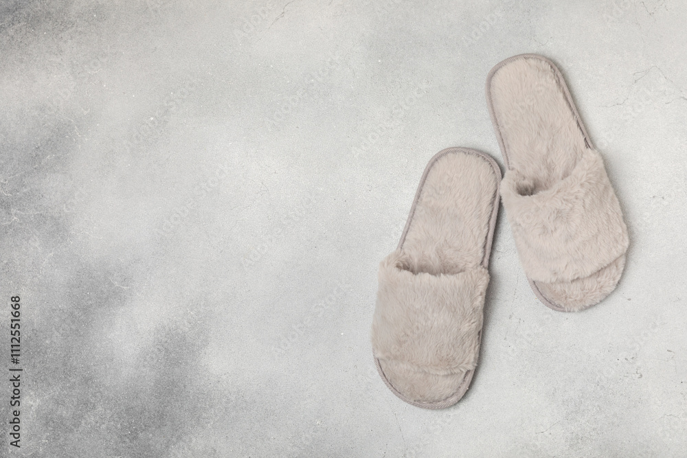 Soft slippers on a bright colored background, close-up. House slippers. Comfortable shoes for home. Foot care concept. Home comfort. Space for text. Copy space. Soft slippers on a bright colored background, close-up. House slippers. Comfortable shoes for home. Foot care concept. Home comfort. Space for text. Copy space.