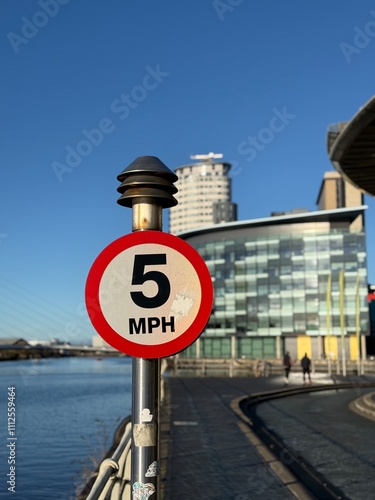 Canvas Print Modern buildings and landmarks next to the water with a clear blue sky background