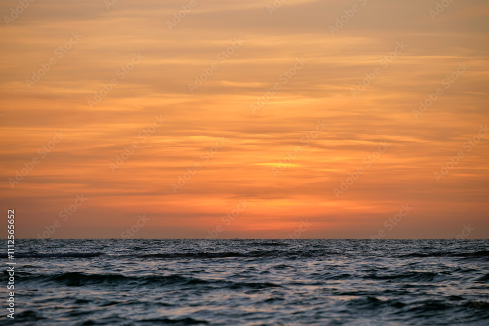 Dramatic red ocean waves at sunset with soft evening sea dark water Dramatic red ocean waves at sunset with soft evening sea dark water