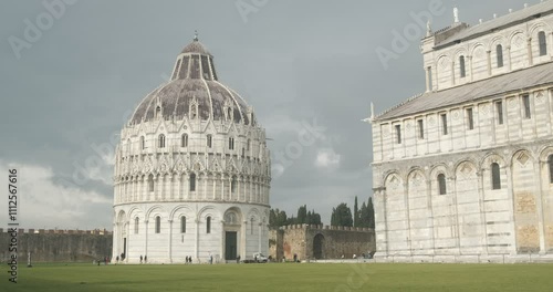 International landmark. Piazza dei Miracoli.Baptistery, Leaning Tower of Pisa and Pisa Cathedral in white marble stand out on a green lawn. Italy