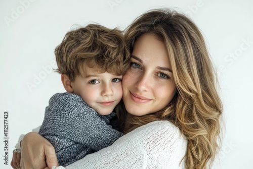 A mother holds a young child in her arms