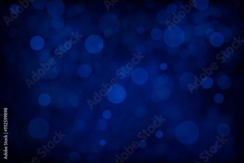 Dark blue bokeh background image. Defocused blue lights for a soft subtle texture