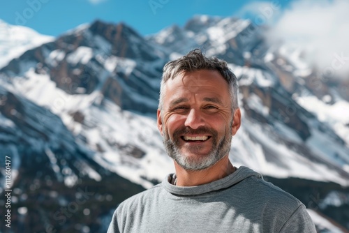 Portrait of a glad man in his 40s donning a trendy cropped top isolated on snowy mountain range