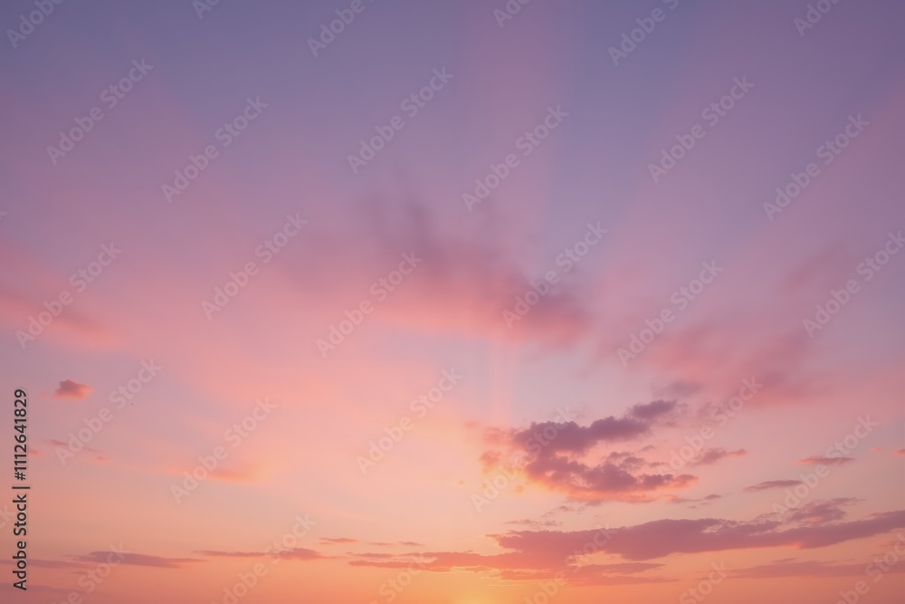 Fototapeta premium Vibrant sunset with pastel sky and radiant clouds creating a serene and tranquil atmosphere.