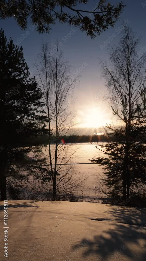 Winter evening landscape. Sunset, field in snow and forest. Beautiful nature background Winter evening landscape. Sunset, field in snow and forest. Beautiful nature background