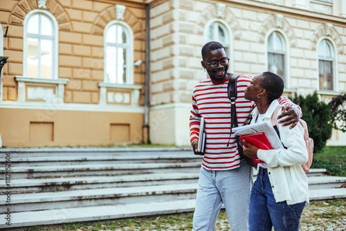 College Friends Walking Together on Campus Holding Books and Smiling