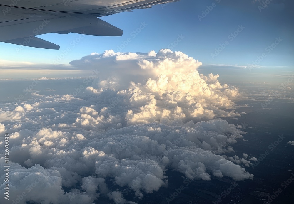 Fototapeta premium Stunning View of Fluffy White Clouds from Airplane Window During Daytime Flight Above Scenic Sky Landscape