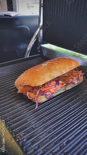 Tasty Glazed Sandwich Filled with Fresh Vegetables and Meat