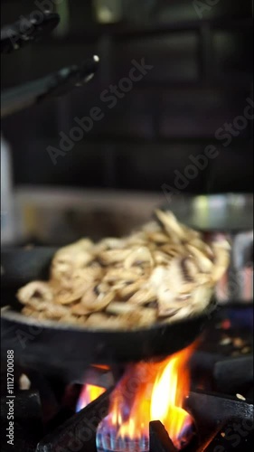 Sautéing Mushrooms in a Hot Pan on the Stove, HD Vertical Video