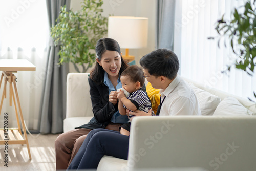 Asian baby and families who have to work while raising children at home