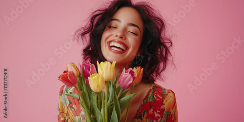 Happy woman holding colorful tulips for valentine's day flower delivery photo