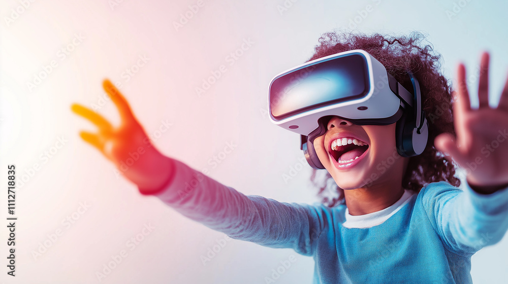 A joyful child reaching out while wearing virtual reality goggles. A joyful child reaching out while wearing virtual reality goggles.