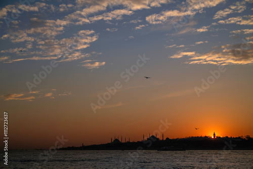 Stunning Istanbul skyline at sunset looking across the Bosphorous Strait.