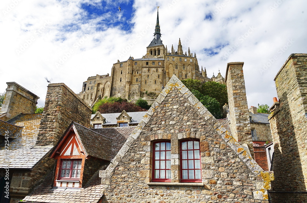 Fototapeta premium Roofs and abbey in Mont Saint Michel in Normandy, France