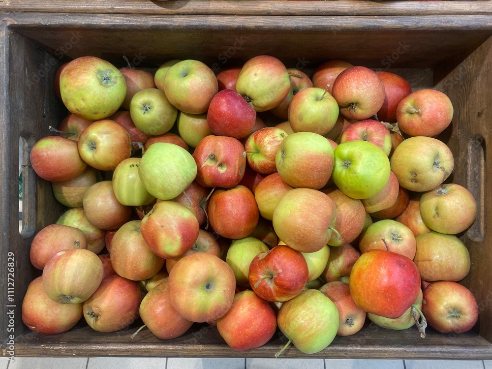 Apples in a box on sale. Apples on the counter at the store
Apples in a box on sale. Apples on the counter at the store
