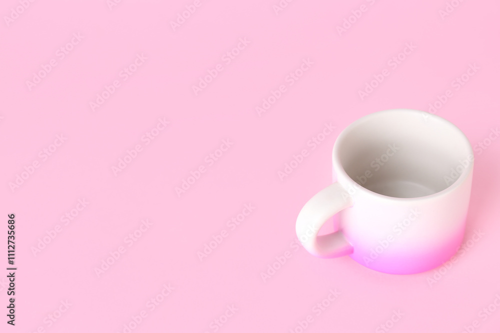 Pink ceramic cup on color background Pink ceramic cup on color background