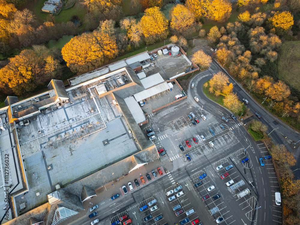 Aerial view of the popular seaside theme park seen on a sunny late autumn evening. Seen surrounded by golden trees. Aerial view of the popular seaside theme park seen on a sunny late autumn evening. Seen surrounded by golden trees.