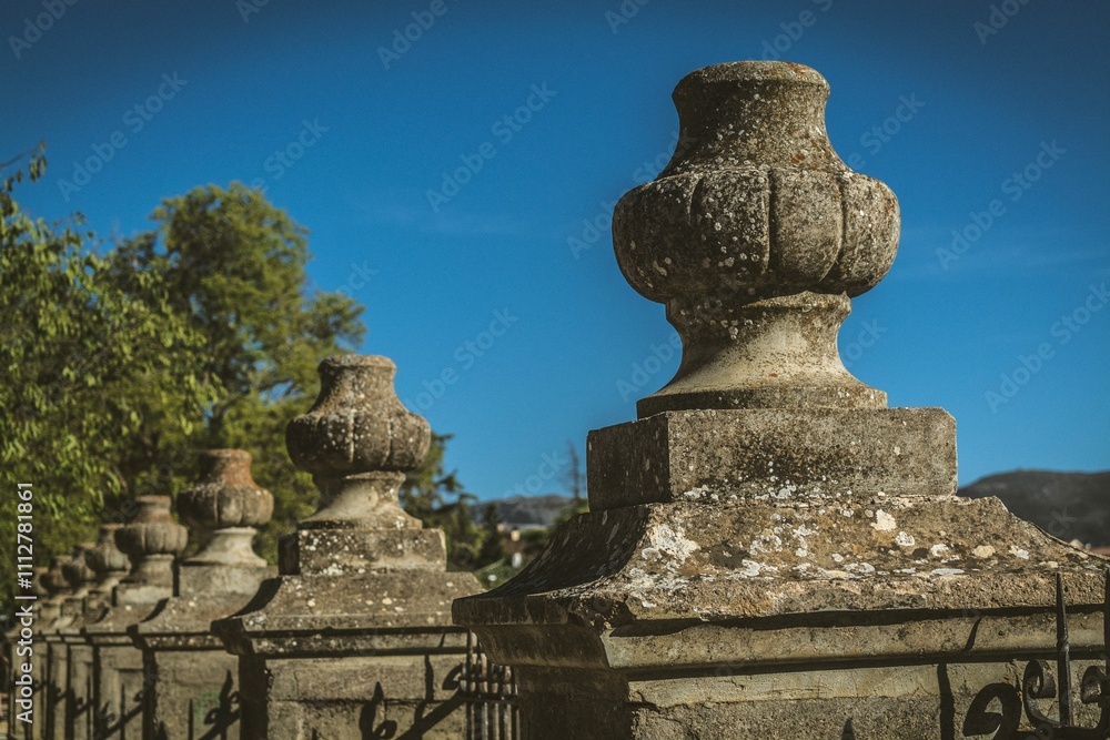 Stone balustrades in a historic garden under a clear blue sky in Ronda, Malaga, Spain Stone balustrades in a historic garden under a clear blue sky in Ronda, Malaga, Spain