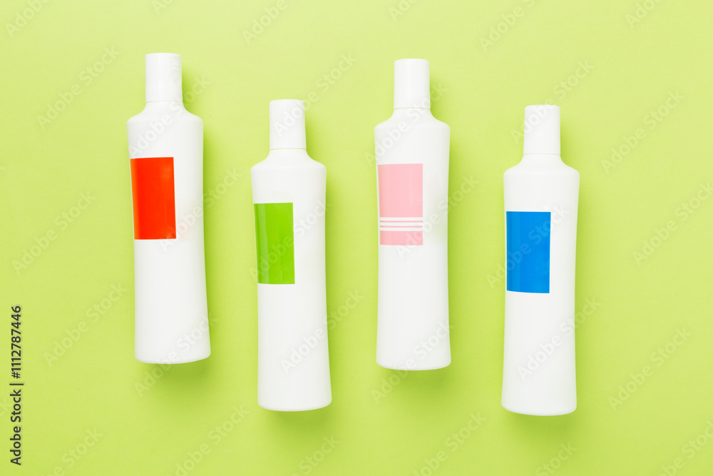 Shampoo bottles on color background, top view Shampoo bottles on color background, top view
