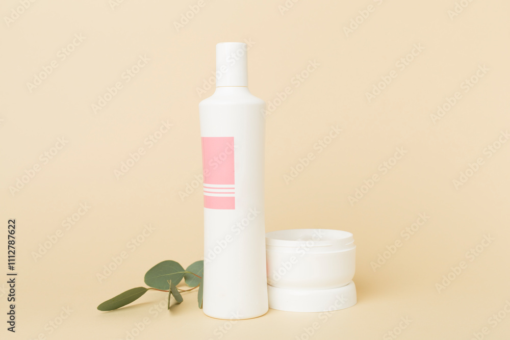Shampoo and hair mask with green leaves on color background Shampoo and hair mask with green leaves on color background