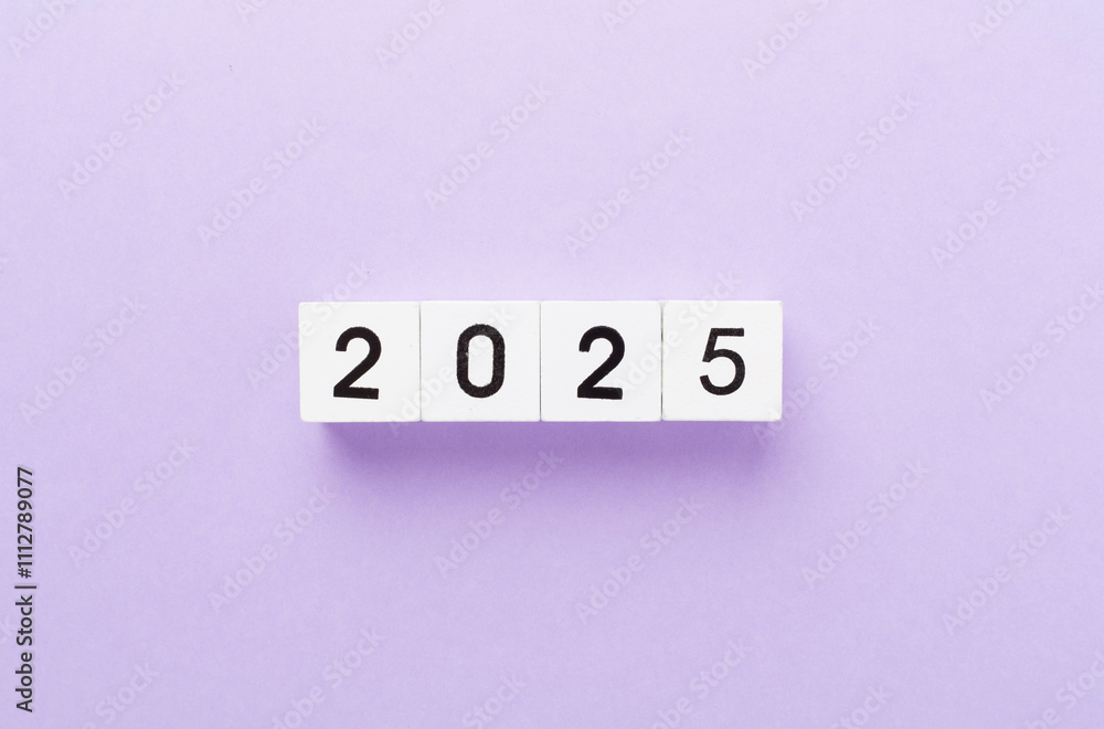 Cubes with 2025 on color background, top view Cubes with 2025 on color background, top view