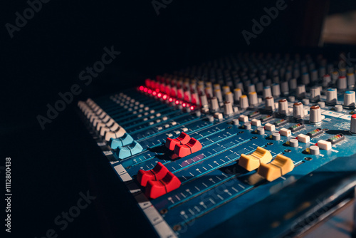 Audio Mixing Console With Colorful Controls in Studio Light photo