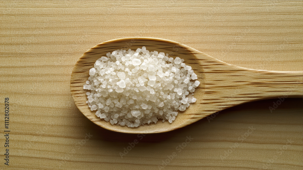 Natural Sea Salt in a Wooden Spoon Ready for Seasoning Dishes With Health Benefits Natural Sea Salt in a Wooden Spoon Ready for Seasoning Dishes With Health Benefits