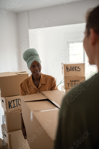 Couple carrying box together