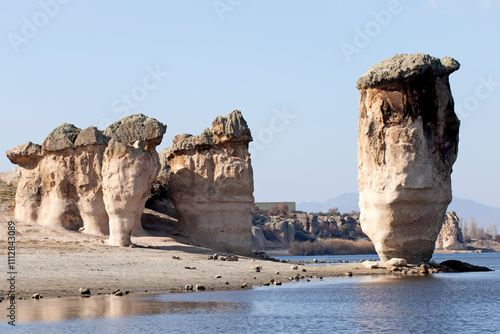 Striking rock formations by the side of Lake Emre in Ihsaniye district in Afyon, Turkey. It is located in the Phrygian Nature park. photo