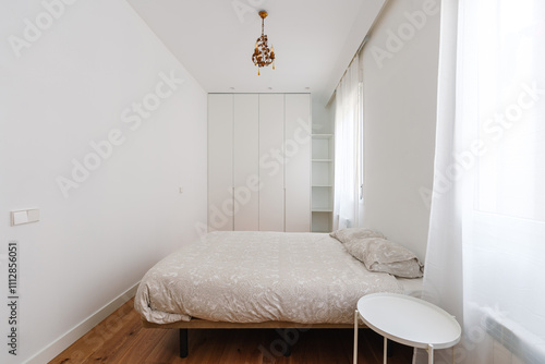 A minimalist and elegant bedroom photo