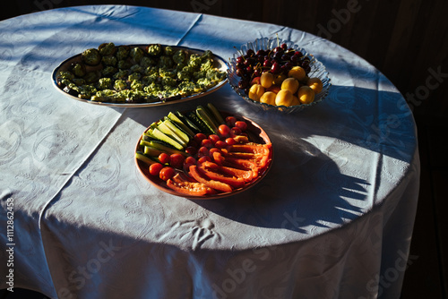 Colorful assortment of fresh fruits and vegetables on a table. photo