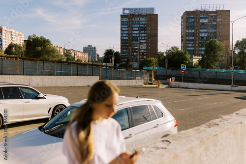 portrait of real young woman on the phone photo